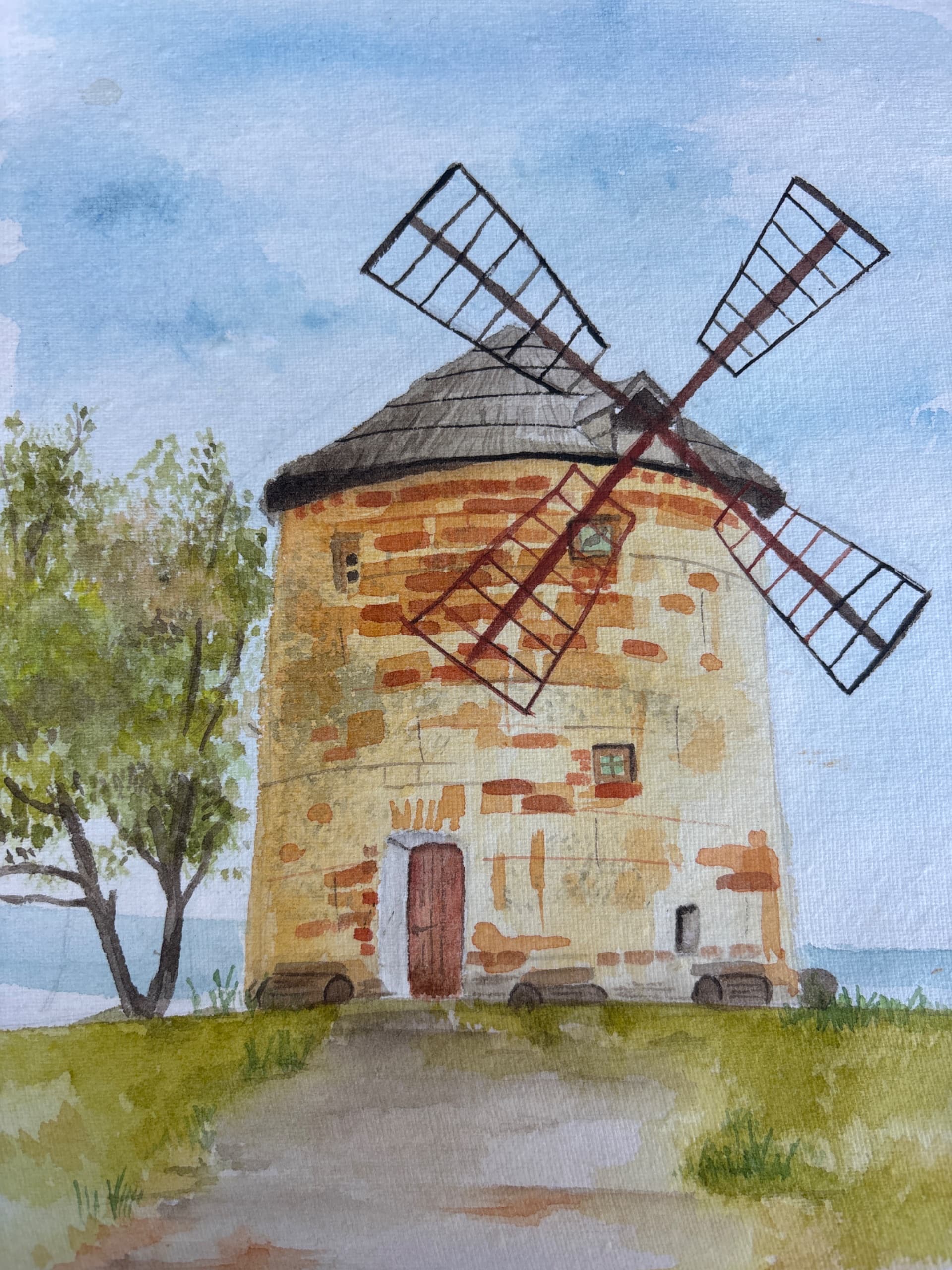 Windmill Beneath Blue Skies