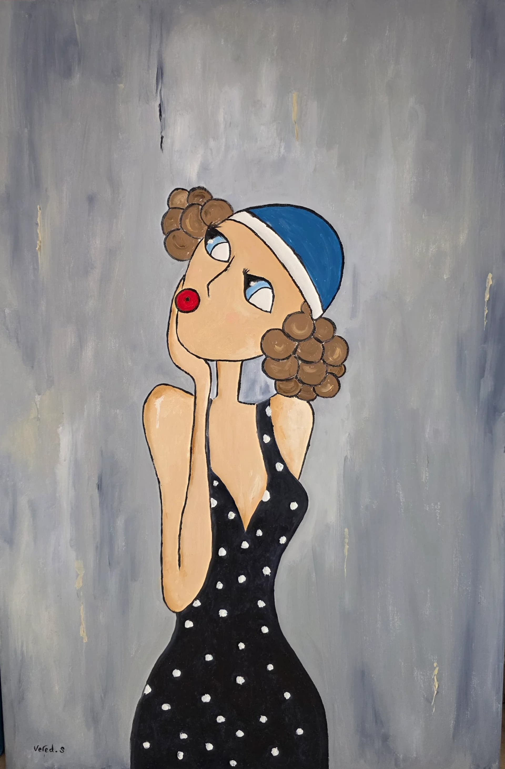 A doll wearing a blue hat